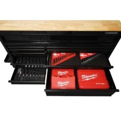 Husky 62 In. W X 36 In. D Standard Duty 12-Drawer Mobile Workbench Tool Chest With Full Length Extension Table In All Black -Husky Shop gloss black with black trim husky mobile workbenches hotc6212b11m 4f 1000