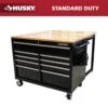 Husky Tool Storage 46 In. W X 51 In. D Standard Duty Black Mobile Workbench Cabinet With Solid Top Full Length Extension Table -Husky Shop gloss black with silver trim husky mobile workbenches hotc4609b15m 64 1000