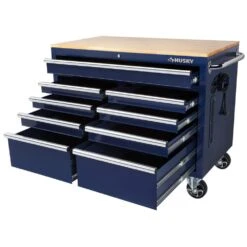Husky 46 In. W X 24.5 In. D Standard Duty 9-Drawer Mobile Workbench Cabinet With Solid Wood Top In Gloss Blue -Husky Shop gloss blue with silver trim husky mobile workbenches h46mwc9gbv2 a0 1000