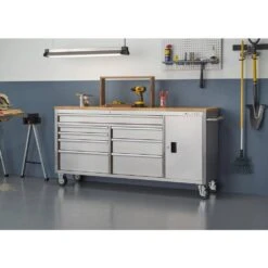 Husky 72 In. W X 18 In. D Heavy Duty 8-Drawer 1-Door Mobile Workbench Tool Chest With Solid Wood Top In Stainless Steel 29 Husky 72 In. W X 18 In. D Heavy Duty 8-Drawer 1-Door Mobile Workbench Tool Chest With Solid Wood Top In Stainless Steel -Husky Shop stainless steel with silver trim husky mobile workbenches hyls 7208 31 1000
