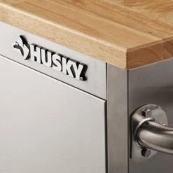 Husky 72 In. W X 18 In. D Heavy Duty 8-Drawer 1-Door Mobile Workbench Tool Chest With Solid Wood Top In Stainless Steel 23 Husky 72 In. W X 18 In. D Heavy Duty 8-Drawer 1-Door Mobile Workbench Tool Chest With Solid Wood Top In Stainless Steel -Husky Shop stainless steel with silver trim husky mobile workbenches hyls 7208 4f 1000